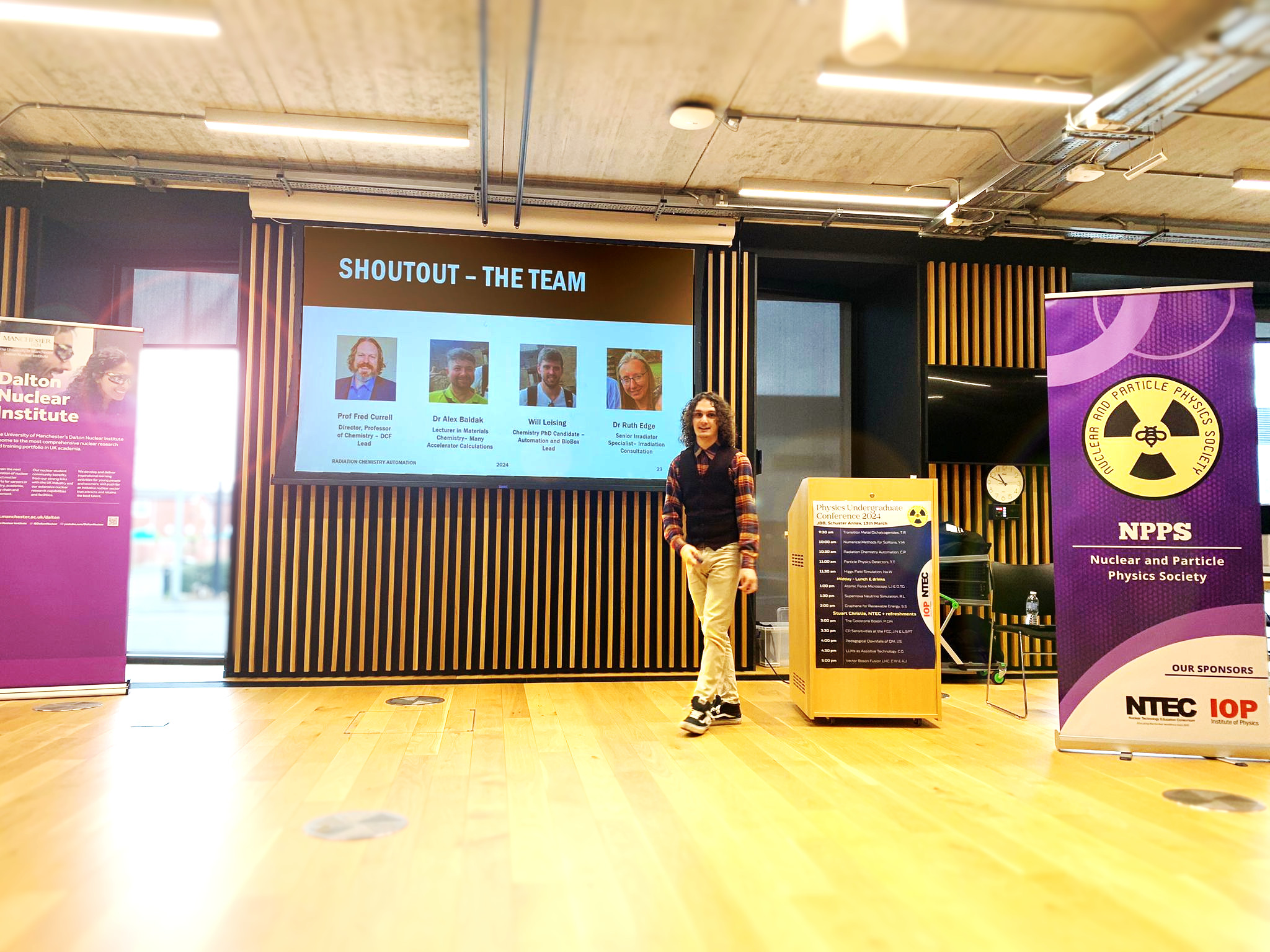 A picture of me presenting at the University of Manchester Physics Undergraduate Conference 2024